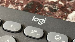 The Logitech Pebble Keys 2 K380S keyboard, with the Logi logo visible prominently.