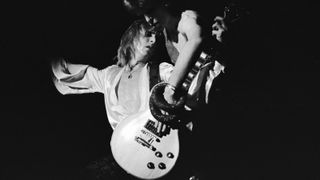 David Bowie (1947-2016) and guitarist Mick Ronson (1945-1993) perform during Bowie&#039;s last appearance as Ziggy Stardust at the Hammersmith Odeon, London, on July 3, 1973. 