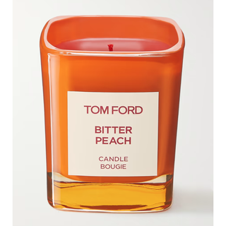 orange tom ford candle with bitter peach scent