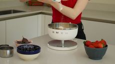 Smeg weighing scales in the test kitchen, surrounded by bowls of fruit