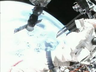 View of Earth from cosmonaut helmet camera in spacewalk.