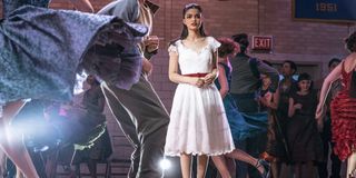 Rachel Zegler stepping onto the dance floor in West Side Story.