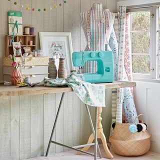 white sewing room with turquoise sewing machine