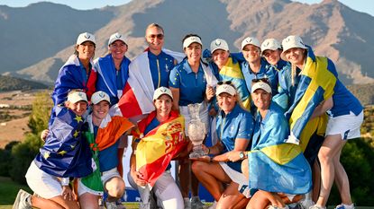 Team Europe poses for a group photo with the Solheim Cup after defeating Team USA during Day Three of The Solheim Cup at Finca Cortesin Golf Club