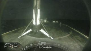 The first stage booster of a SpaceX Falcon 9 rockets stands atop the drone ship Just Read The Instructions after a successful landing at sea following the launch of 60 Starlink internet satellites from Cape Canaveral Air Force Station in Florida on June 3, 2020.