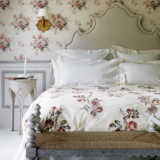 bedroom with floral wallpaper wall and bed