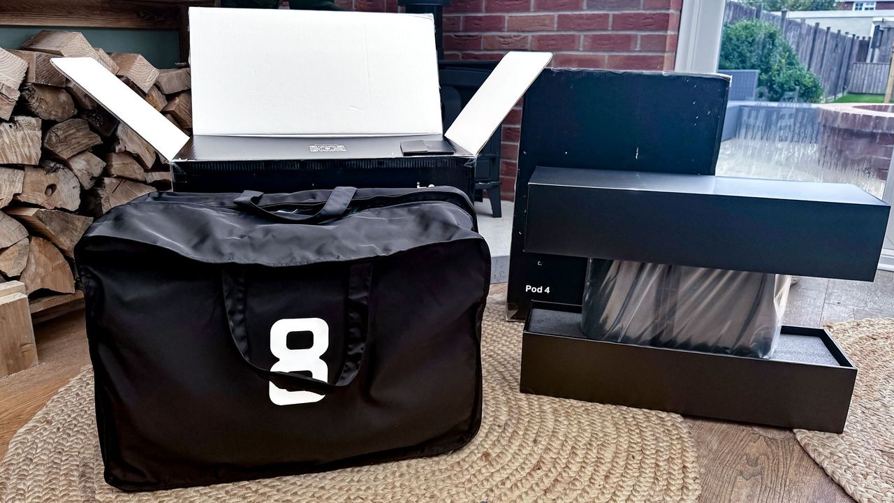 Eight Sleep pod 4 mattress cover in bag and control hub in box