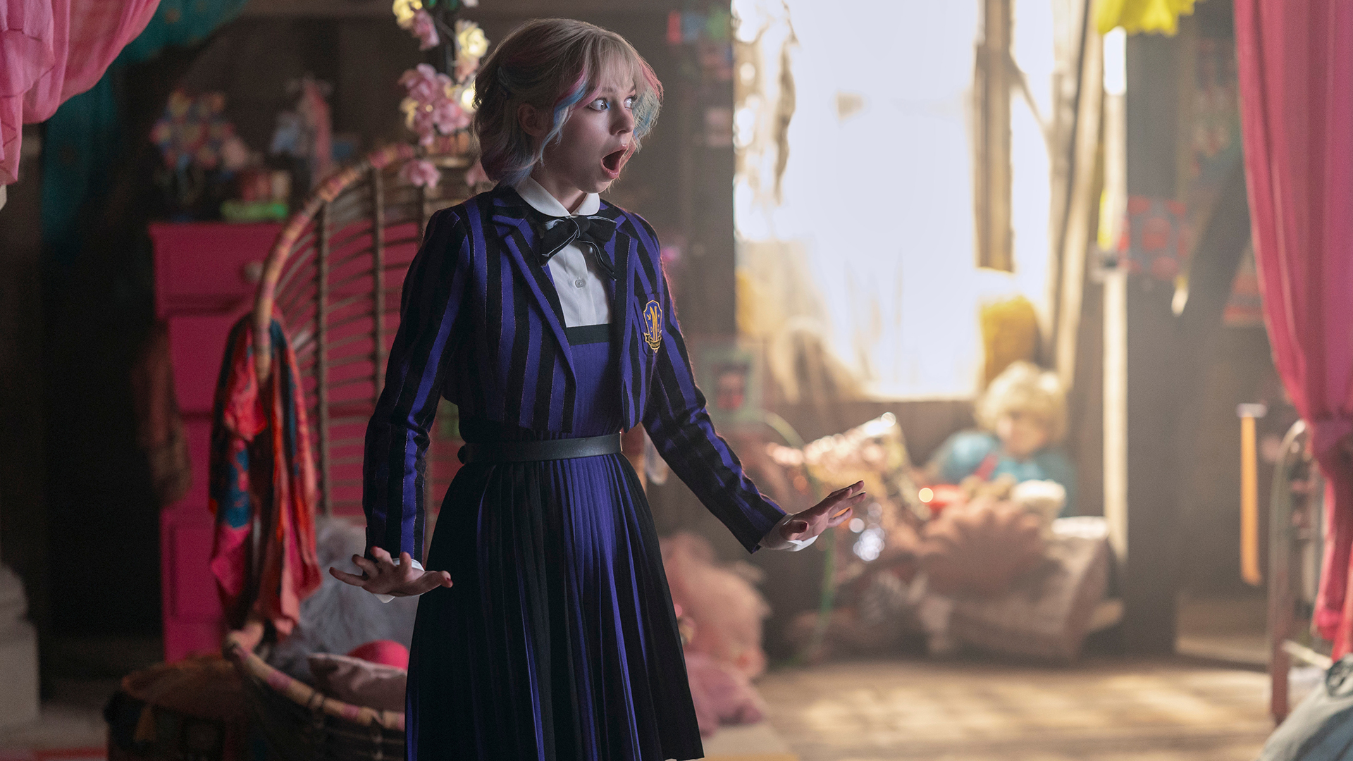 Enid Sinclair looking shocked in her dorm room in Wednesday season 2