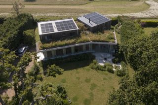 timber cladding on modern self build with green roof