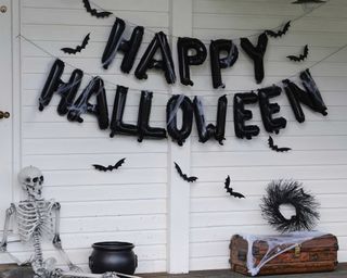 Halloween balloon bunting and hanging bats on porch