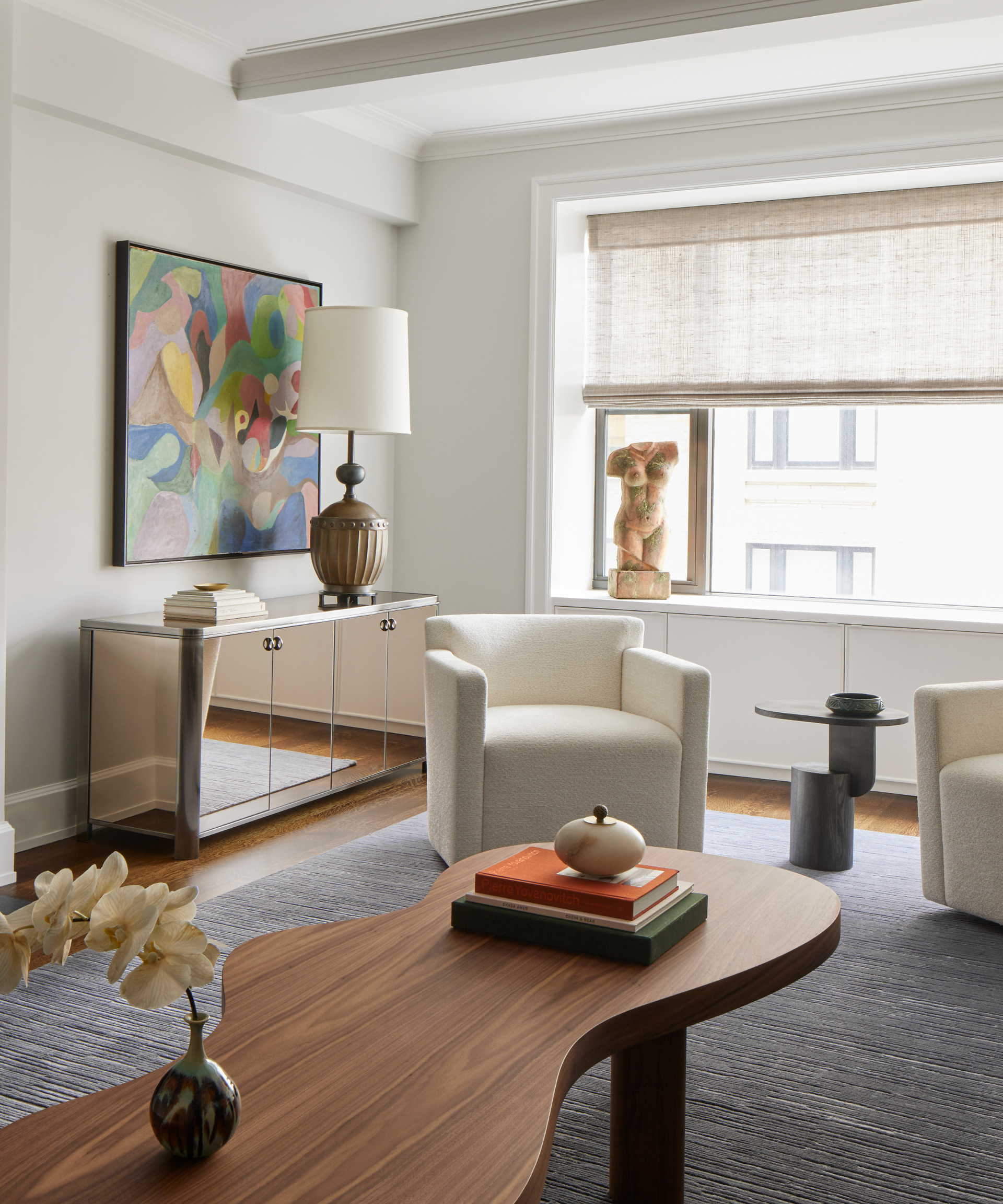 A modern living room decorated with antique furniture