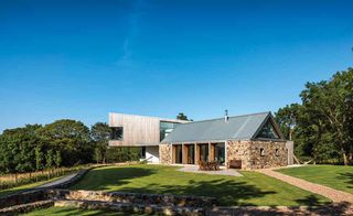 Cantilevered two storey extension to stone barn