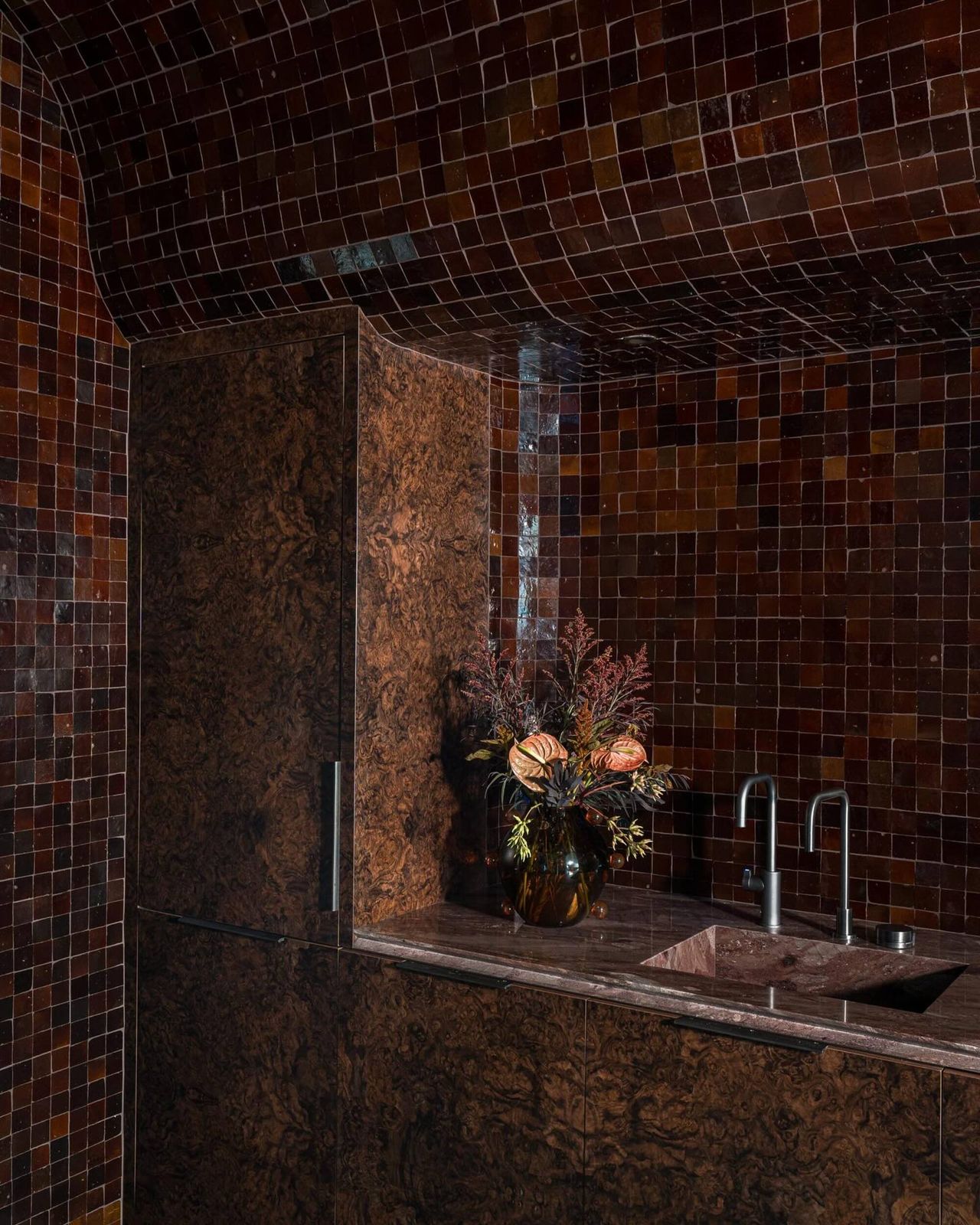 tile-drenched galley kitchen in a rich shade of brown