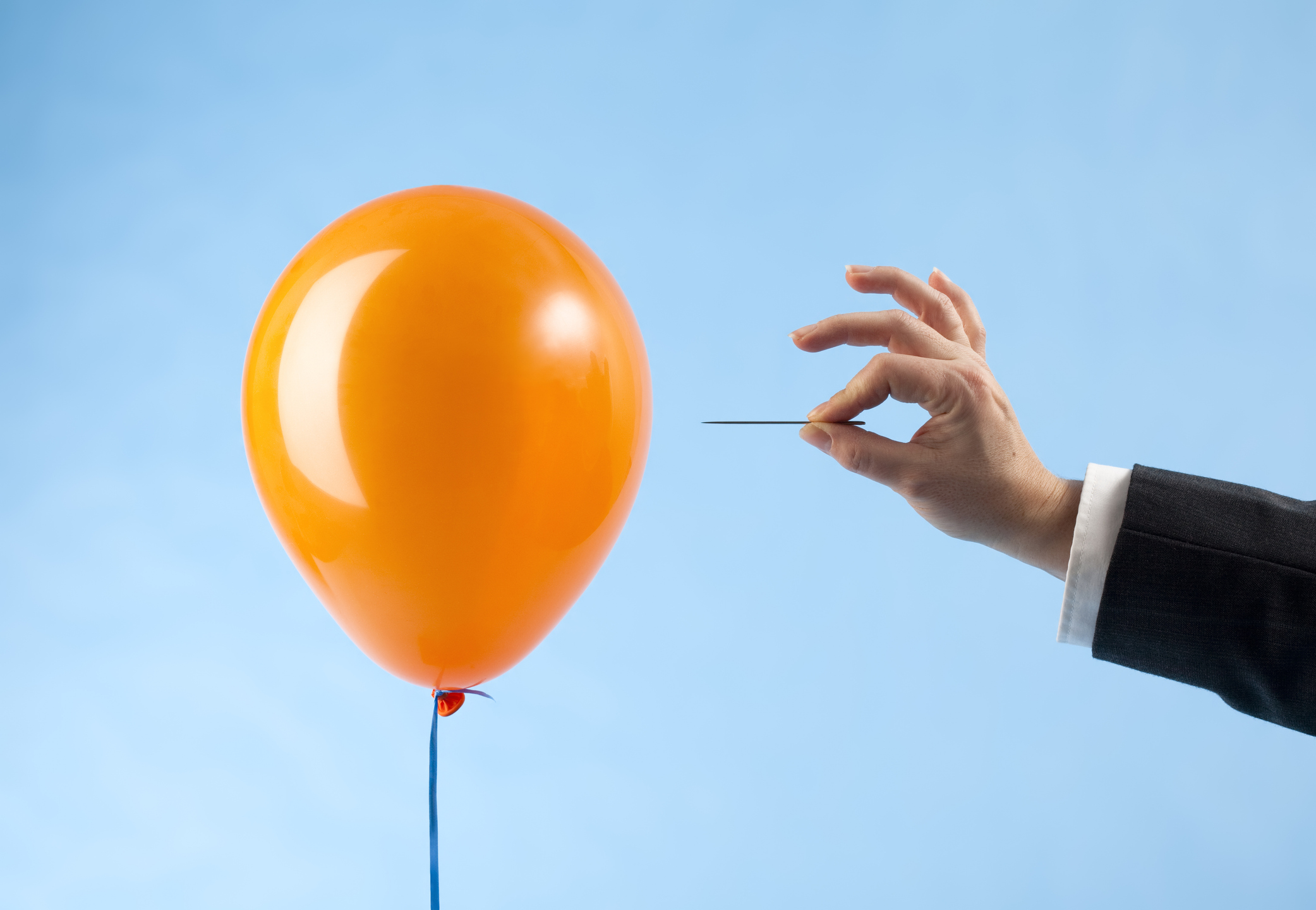 Inflation concept - balloon being popped