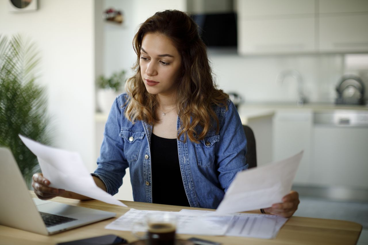 Cost of living: a serious young woman working from home