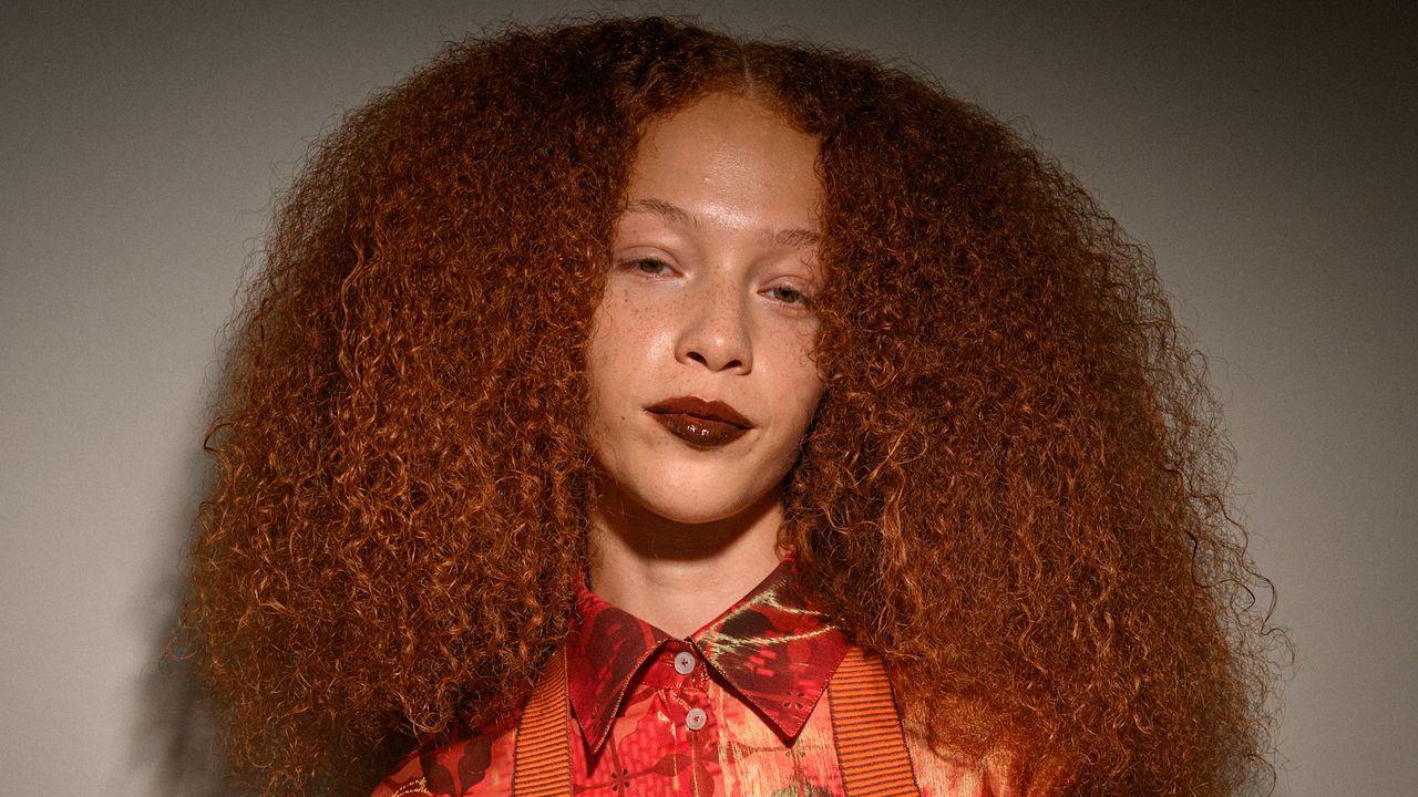 woman with long, curly hair