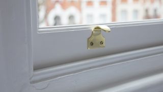 brass sash lift handle on sash window