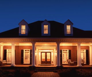 Porch light at night Cape Cod colonial house