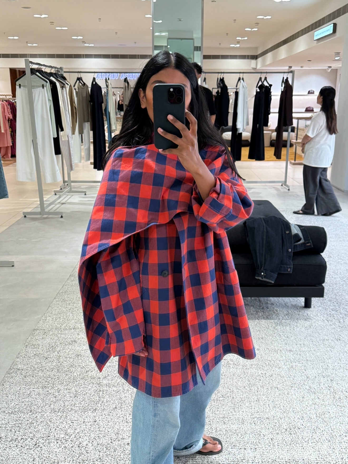 An image of @monikh wearing one of the best cape coats from The Row.