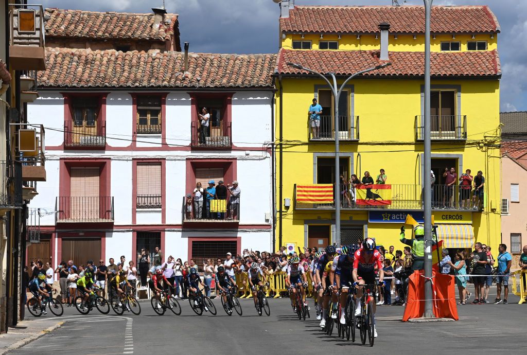 OBSERVATORIO ASTROFSICO DE JAVALAMBRE SPAIN AUGUST 31 LR Hugh Carthy of The United Kingdom and Team EF EducationEasyPost Michael Storer of Australia Rudy Molard of France and Team Groupama FDJ Dylan Van Baarle of The Netherlands and Team JumboVisma nd a general view of the breakaway passing through Sarrin Village during the 78th Tour of Spain 2023 Stage 6 a 1831km stage from La Vall dUix to Observatorio Astrofsico de Javalambre 1947m UCIWT on August 31 2023 in Observatorio Astrofsico de Javalambre Spain Photo by Tim de WaeleGetty Images