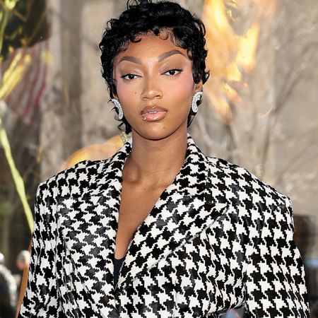 Angel Reese celebrated her Victoria's Secret campaign debut in a matching herringbone skirt set 