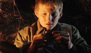The Seeker: The Dark is Rising Alexander Ludwig holds a cryptic object in his hands