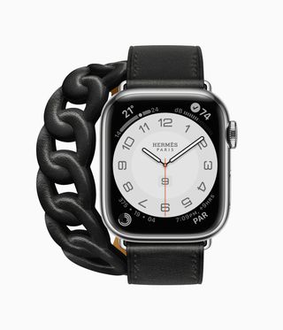 Black Apple Watch Hermès series 8 with black leather chain strap, against a white background