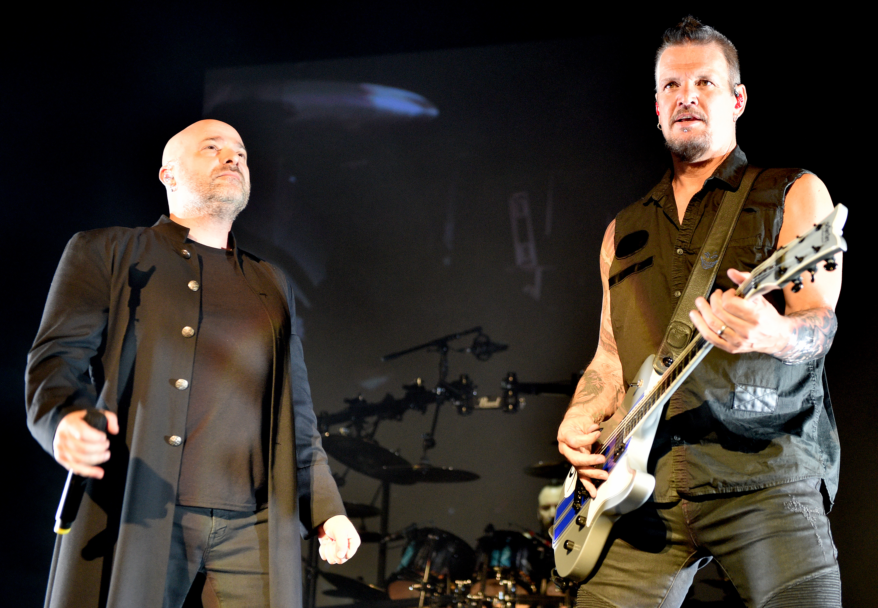 David Draiman (left) and Dan Donegan of Disturbed perform onstage at the O2 Apollo Manchester in Manchester, England on May 14, 2019