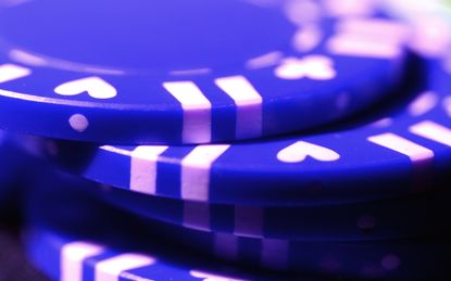 Closeup on a stack of blue poker chips