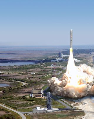 An artist's illustration of an Orbital Sciences Taurus 2 rocket launcing from Wallops Flight Facility in Wallops Island, Va.