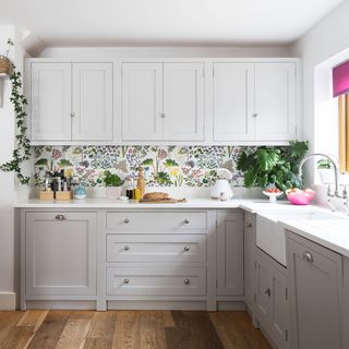 grey kitchen with floral wallpaper