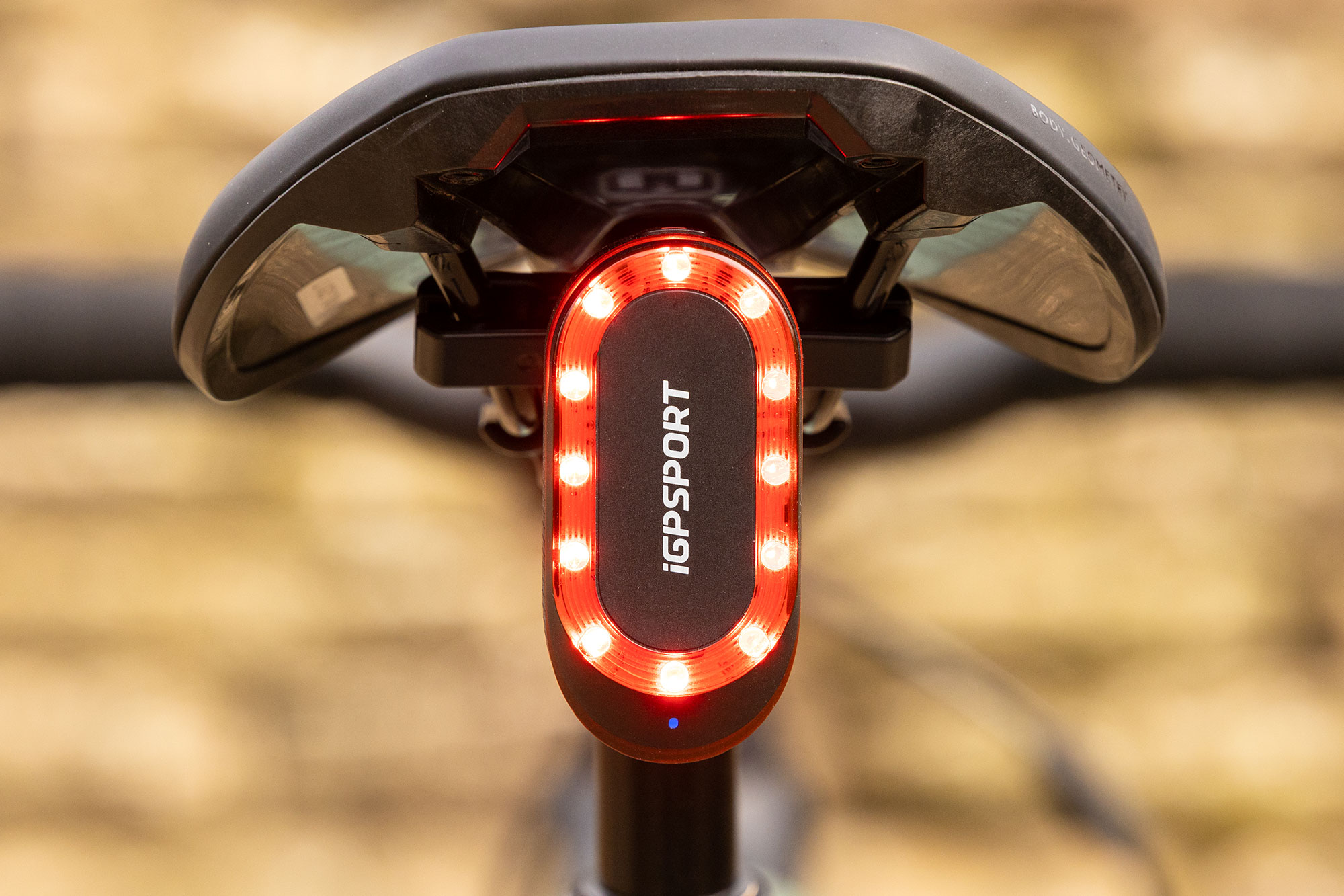 iGPSport SR Mini pictured from the rear, mounted on saddle rail mount