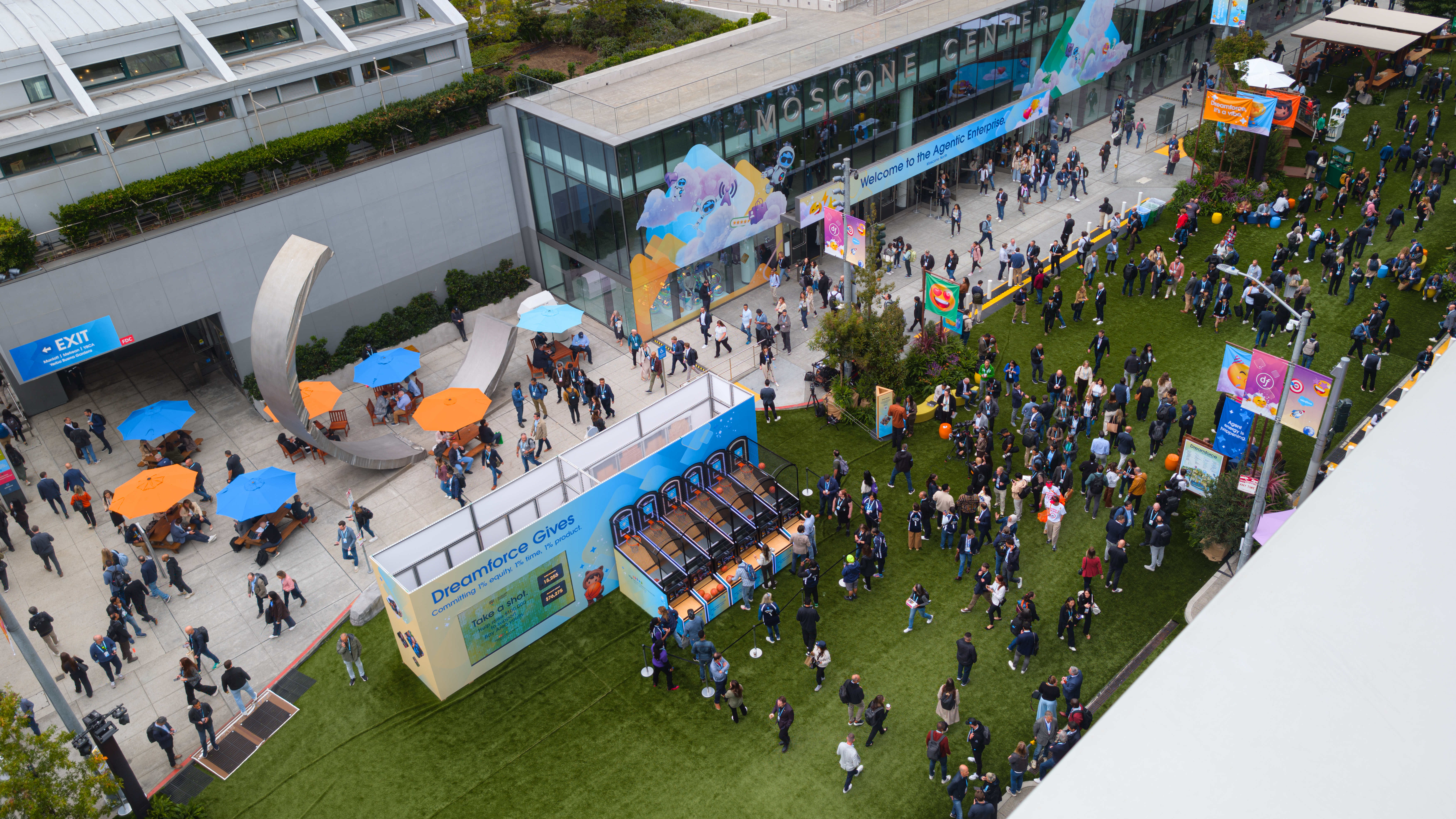 An overhead view of the attendees walking around the outdoor area of the Moscone Center South at Dreamforce 2025.