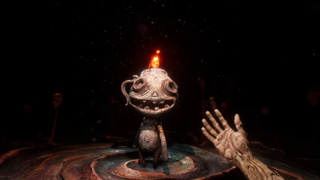 A clay guy with a flame on his head