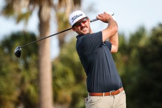 Lanto Griffin watches his tee shot with a driver