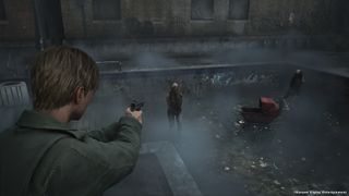 Silent Hill 2 Remake in-development screenshot of James Sunderland pointing a gun at an armless monster, standing in an empty swimming pool.