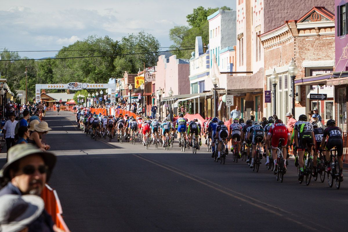 The men get strung out going through the finish line.