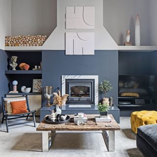 navy living room with large chimney breast and fireplace