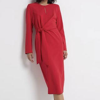 A model wearing a red River Island Red Tie Front Midi Dress