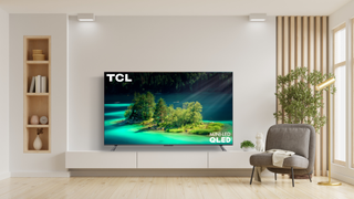 TCL 85-inch 6-Series TV in living room with green image onscreen