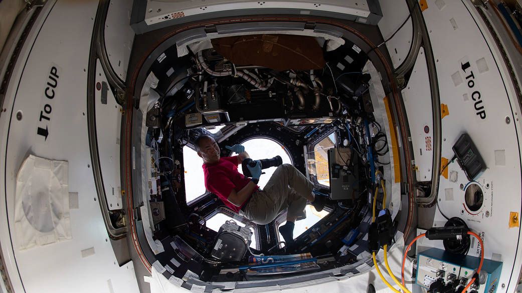 Flight Engineer Soichi Noguchi with his Nikon D5 in the ISS Cupola (Image credit: NASA)