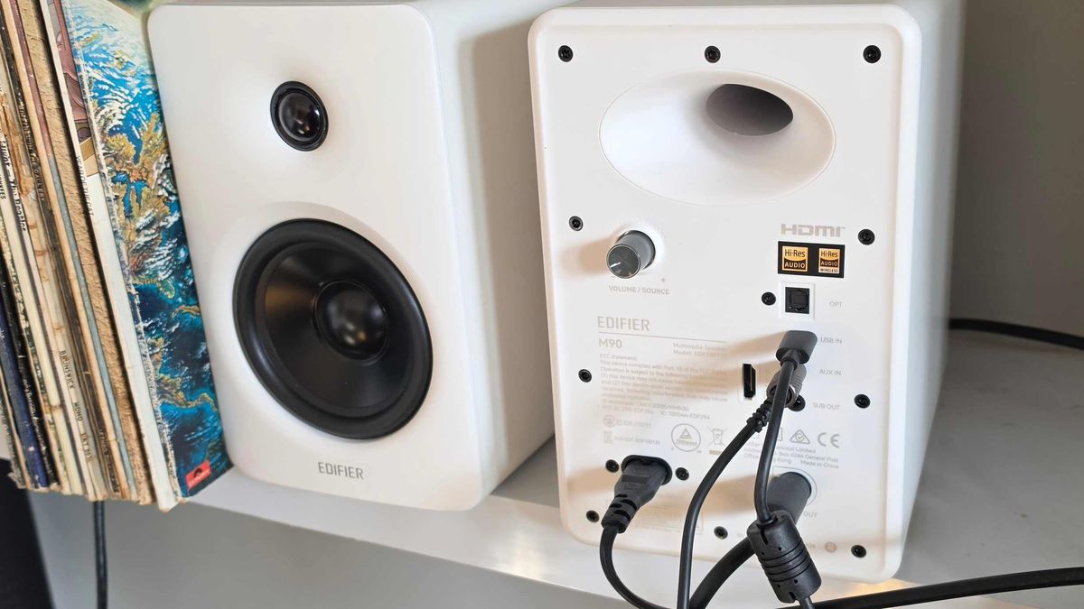 The two Edifier M90 units besides each other, with one showing its back panel.