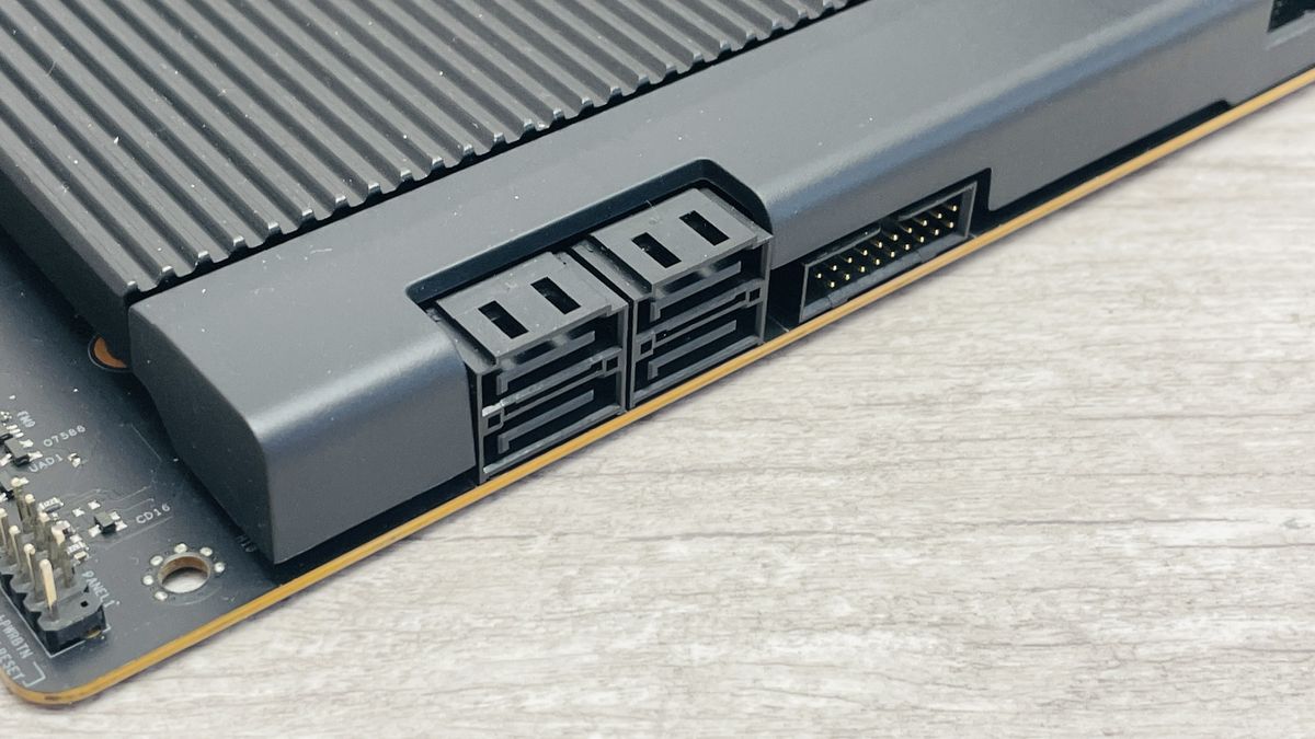 An NZXT N9 X870E motherboard in black with the port covers removed.