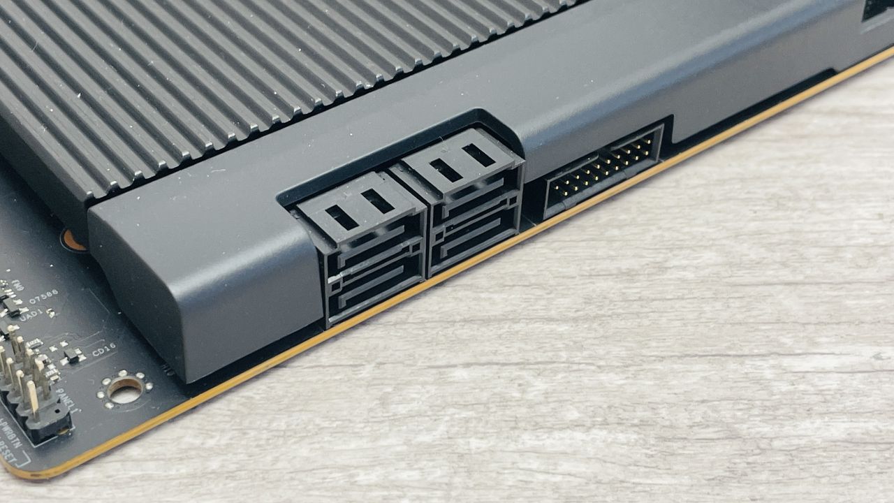An NZXT N9 X870E motherboard in black with the port covers removed.