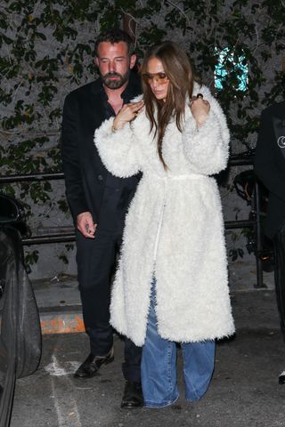 Jennifer Lopez in a white fuzzy coat with Ben Affleck.