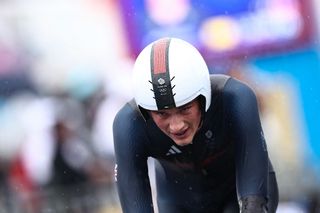 Britain&#039;s Josh Tarling cycles to cross the finish line of the men&#039;s road cycling individual time trial during the Paris 2024 Olympic Games in Paris, on July 27, 2024. (Photo by Anne-Christine POUJOULAT / AFP)