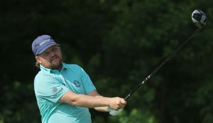 Zac Blair hits a tee shot with a driver