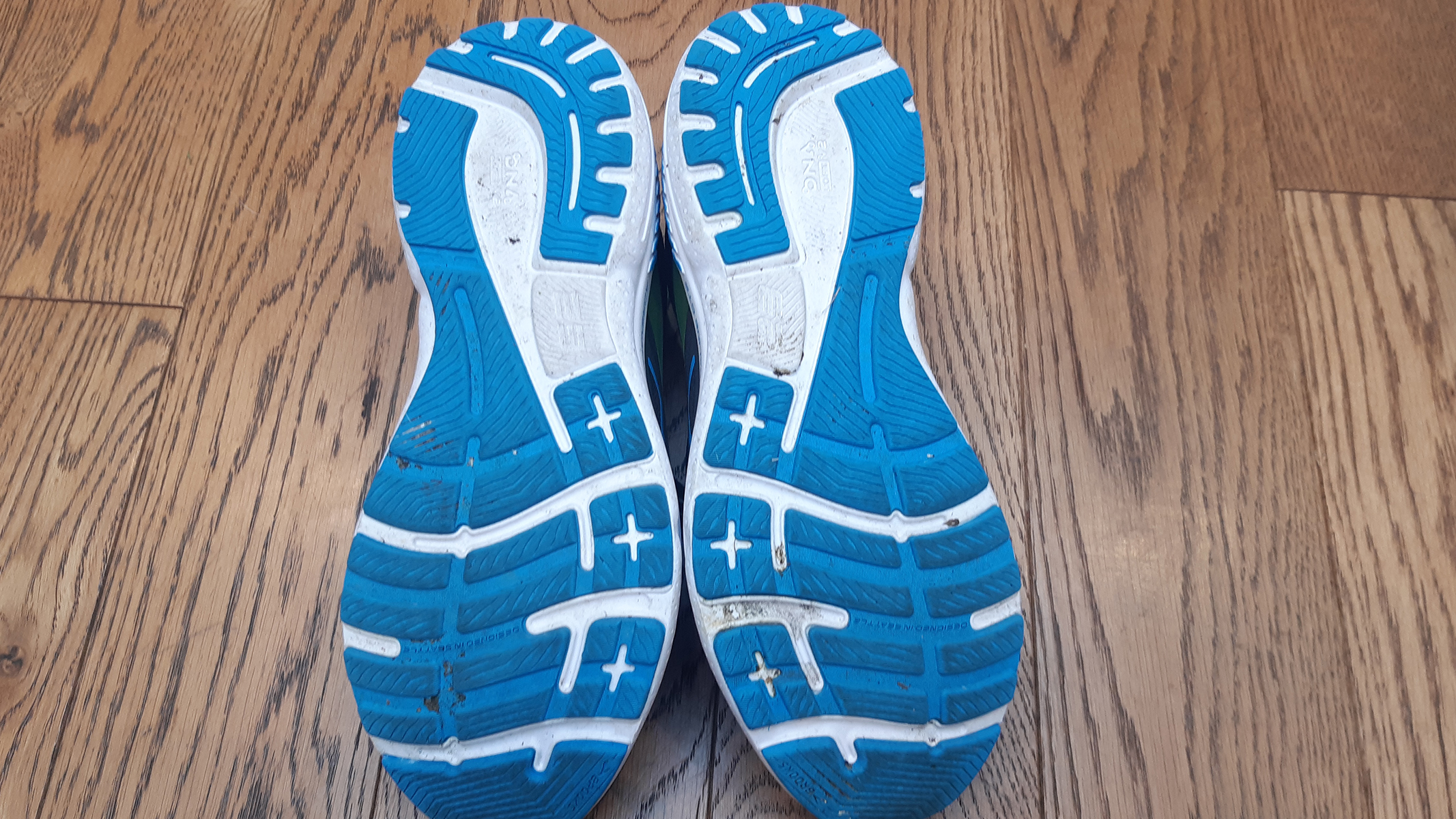 The blue and white outsoles of the Brooks Adrenaline GTS 23