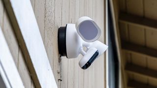 Arlo Wired Floodlight Camera attached to side of house