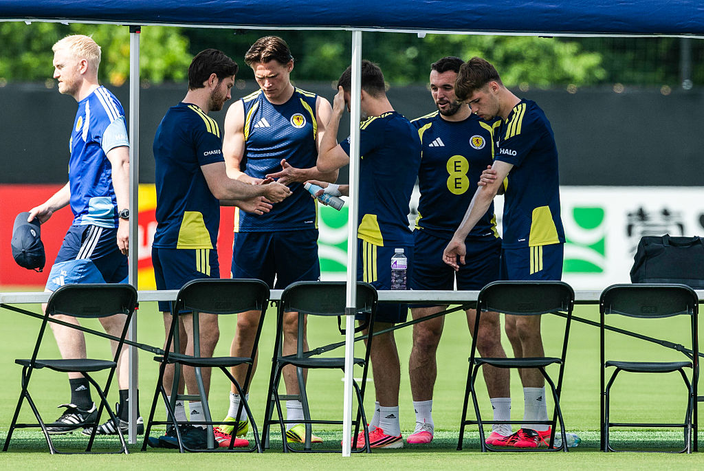 Scotland's Anthony Ralston, Scott McTominay, Kieran Tierney, John McGinn and Tyler Fletcher apply suncream during a Scotland Men's National Team training session ahead of the 2026 FIFA World Cup
